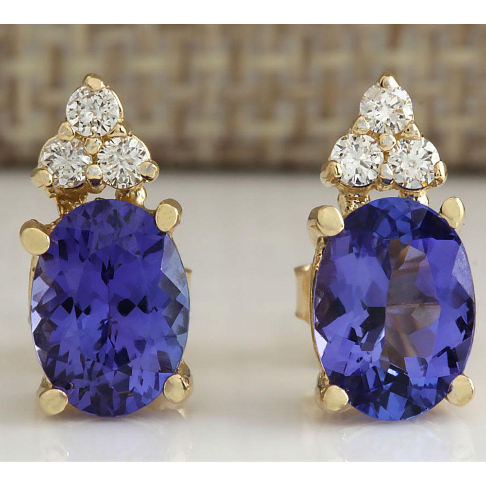 2.79 CTW Natural Blue Tanzanite And Diamond Earrings: 2.79 CTW Natural Blue Tanzanite And Diamond Earrings 14K Solid Yellow Gold Manufacturer's Suggested Retail Price: $ 2300.00 Stamped: 14K Total Earring Weight: 2.5Grams Diamond Weight: Total Natural di