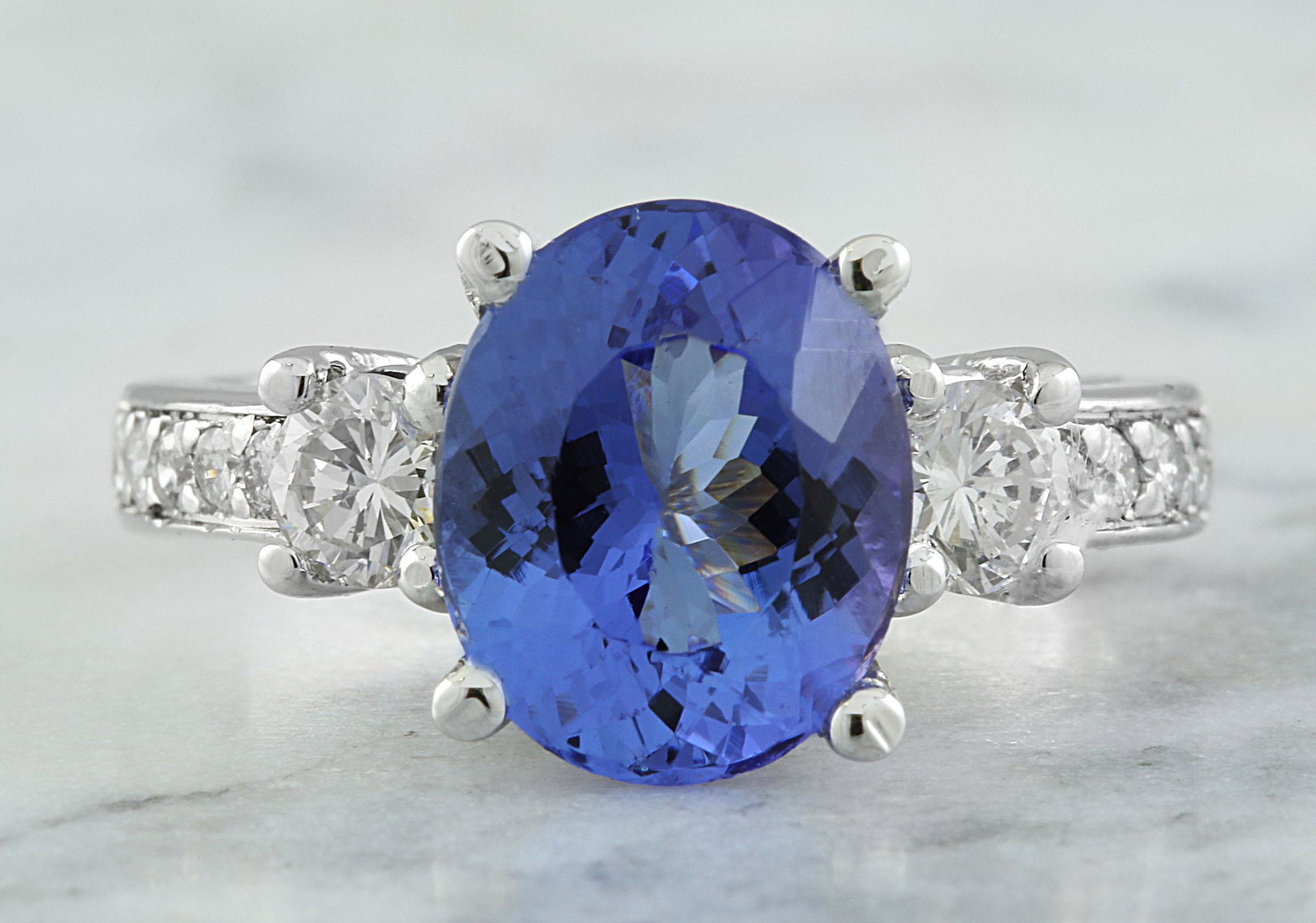 3.95 CTW Tanzanite 18K White Gold Diamond Ring: 3.95 CTW Tanzanite 18K White Gold Diamond Ring Manufacturer's Suggested Retail Price: $ 5000.00 Stamped: 18K Ring Size: 7 Total Ring Weight: 5.2 Grams Tanzanite Weight: 3.25 Carat (10.40x8.50 Millimet