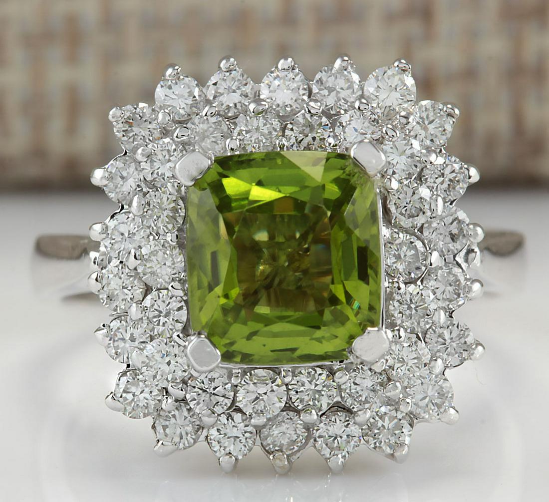 3.55 CTW Natural Peridot And Diamond Ring 14K Solid: 3.55 CTW Natural Peridot And Diamond Ring 14K Solid White Gold Manufacturer's Suggested Retail Price: $ 3600.00 Stamped: 14K Ring Size: 6.75 Total Ring Weight: 5.8 Grams Diamond Weight: Total Natural 