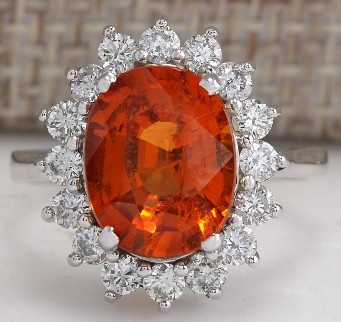 5.91CTW Natural Mandarin Garnet And Diamond Ring In14K: 5.91CTW Natural Mandarin Garnet And Diamond Ring In14K White Gold Manufacturer's Suggested Retail Price: $ 5500.00 Stamped: 14K Ring Size: 6.75 Total Ring Weight: 4.8 Grams Diamond Weight: Total Natur