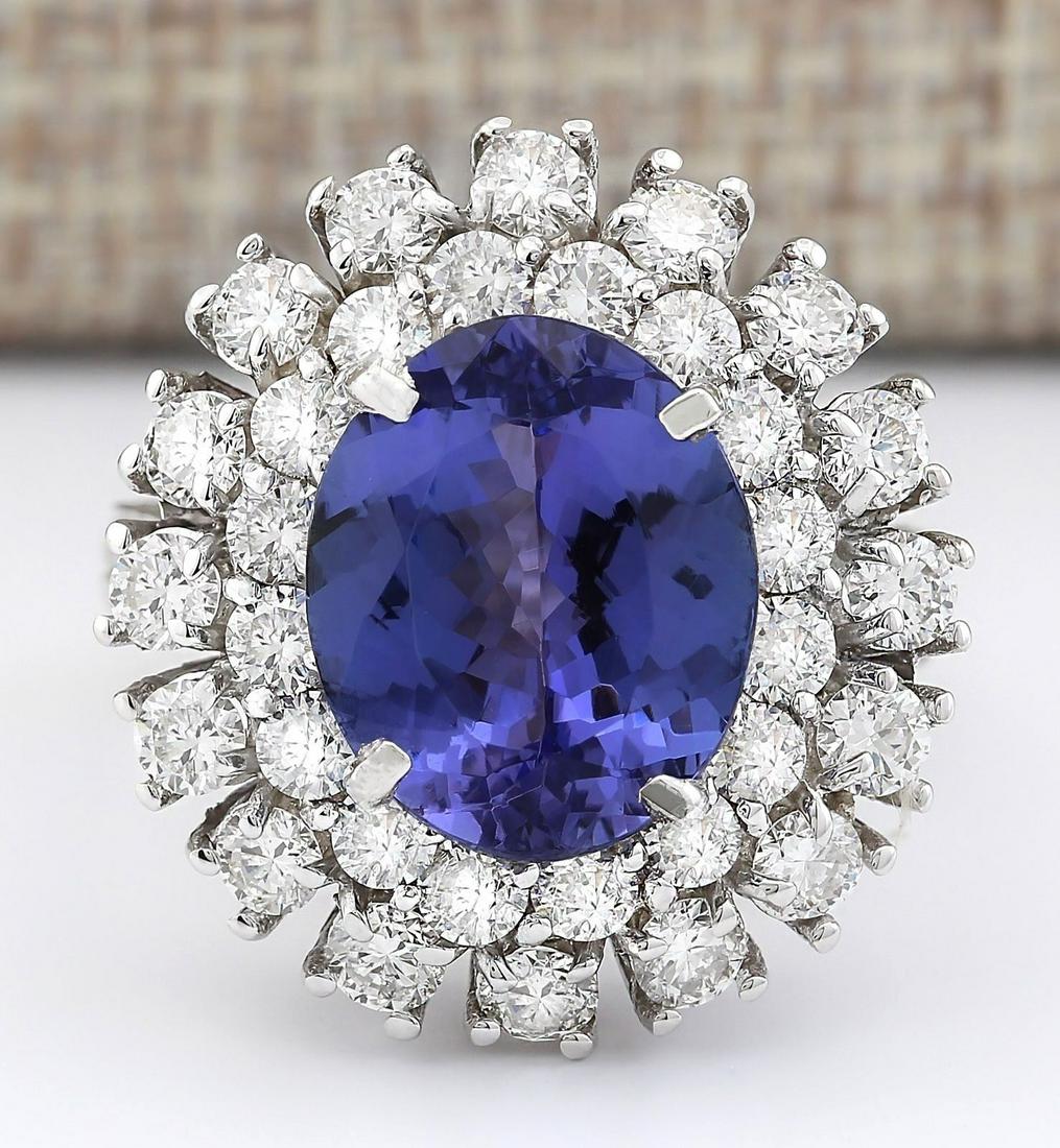 8.89 CTW Natural Blue Tanzanite And Diamond Ring 18K: 8.89 CTW Natural Blue Tanzanite And Diamond Ring 18K Solid White Gold Manufacturer's Suggested Retail Price: $ 10900.00 Stamped: 18K Ring Size: 6 Total Ring Weight: 9.2 Grams Diamond Weight: Total Nat