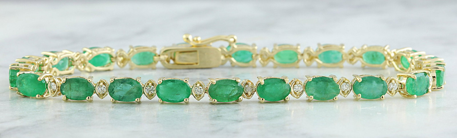 11.20 CTW Emerald 18K Yellow Gold Diamond Bracelet: 11.20 CTW Emerald 18K Yellow Gold Diamond Bracelet Manufacturer's Suggested Retail Price: $ 4500.00 Stamped: 18K Total Bracelet Weight: 8.9 Grams Bracelet Length: 7 Inches Emerald Weight: 10.60 Carat 