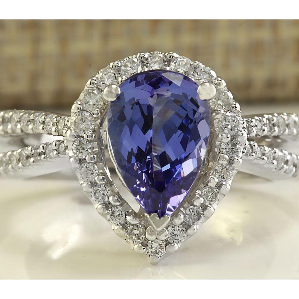 2.94 CTW Natural Blue Tanzanite And Diamond Ring 14K Solid White Gold: 2.94 CTW Natural Blue Tanzanite And Diamond Ring 14K Solid White Gold Manufacturer's Suggested Retail Price: $ 4700.00 Stamped: 14K Ring Size: 5.75 Total Ring Weight: 6.1 Grams Diamond Weight: Total N