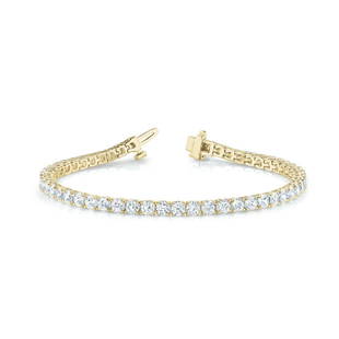 Natural 8.93 CTW Diamond Bracelet 18K Yellow Gold: Natural 8.93 CTW Diamond Bracelet 18K Yellow Gold Manufacturer's Suggested Retail Price: $30900.00 Product Type: Diamond Bracelet Stone1 Type: 47 Diamonds @ 8.93 CTW Stone1 Color: G Stone1 Clarity: