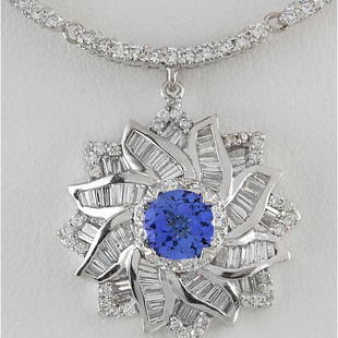 15.00 CTW Natural Tanzanite And Diamond Necklace In 18K White Gold: 15.00 CTW Natural Tanzanite And Diamond Necklace In 18K White Gold Manufacturer's Suggested Retail Price: $ 29000.00 Stamped: 18K Total Necklace Weight: 22Grams Diamond Weight: Total