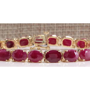 30.89 CTW Natural Red Ruby Bracelet In 14k Yellow Gold: 30.89 CTW Natural Red Ruby Bracelet In 14k Yellow Gold Manufacturer's Suggested Retail Price: $ 7600.00 Stamped: 14K Bracelet Width: 6.20mm Bracelet Length: 7.0 Inches Total Bracelet