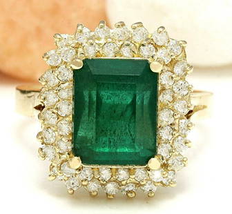 4.80 CTW Natural Emerald 18K Solid Yellow Gold Diamond Ring: 4.80 CTW Natural Emerald 18K Solid Yellow Gold Diamond Ring Manufacturer's Suggested Retail Price: $ 5600.00 4.80 Carat Natural Emerald 18K Solid Yellow Gold Diamond Ring Item Type: Ring 