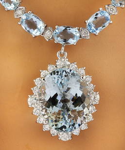 43.35 CTW Aquamarine 14K White Gold Diamond Necklace: 43.35 CTW Aquamarine 14K White Gold Diamond Necklace Manufacturer's Suggested Retail Price: $ 13800.00 Stamped: 14K Total Necklace Weight: 34 Grams Necklace Length: 19 Inches Center Aquamarine