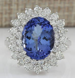5.72 CTW Natural Blue Tanzanite And Diamond Ring 18K Solid White Gold: 5.72 CTW Natural Blue Tanzanite And Diamond Ring 18K Solid White Gold Manufacturer's Suggested Retail Price: $ 6700.00 Stamped: 18K Ring Size: 6.25 Total Ring Weight: 6.5 Grams Diamond