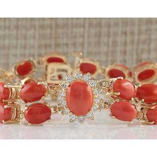 31.50CTW Natural Red Coral And Diamond Bracelet In 18K Solid Yellow Gold: 31.50CTW Natural Red Coral And Diamond Bracelet In 18K Solid Yellow Gold Manufacturer's Suggested Retail Price: $ 9900.00 Stamped: 18K Bracelet Width: 13.83mm Bracelet Length: 7.0 Inches 