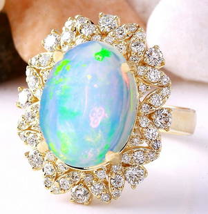 7.68 CTW Natural Opal 18K Solid Yellow Gold Diamond Ring: 7.68 CTW Natural Opal 18K Solid Yellow Gold Diamond Ring Manufacturer's Suggested Retail Price: $ 4800.00 7.68 Carat Natural Opal 18K Solid Yellow Gold Diamond Ring Item Type: Ring Item