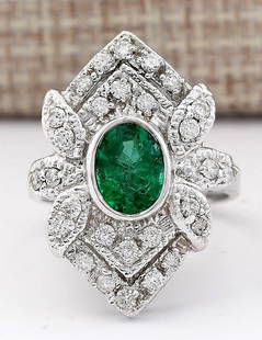 2.50 CTW Natural Emerald And Diamond Ring In 18K White Gold: 2.50 CTW Natural Emerald And Diamond Ring In 18K White Gold Manufacturer's Suggested Retail Price: $ 4600.00 Stamped: 18K Ring Size: 7 Total Ring Weight: 7.5 Grams Diamond Weight: Total
