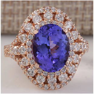 5.72 CTW Natural Blue Tanzanite And Diamond Ring 14K Solid Rose Gold: 5.72 CTW Natural Blue Tanzanite And Diamond Ring 14K Solid Rose Gold Manufacturer's Suggested Retail Price: $ 6200.00 Stamped: 14K Ring Size: 6.75 Total Ring Weight: 7.5 Grams Diamond
