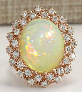 8.11 CTW Natural Opal And Diamond Ring In 18K Rose Gold: 8.11 CTW Natural Opal And Diamond Ring In 18K Rose Gold Manufacturer's Suggested Retail Price: $ 5700.00 Stamped: 18K Ring Size: 6.75 Total Ring Weight: 10 Grams Diamond Weight: Total