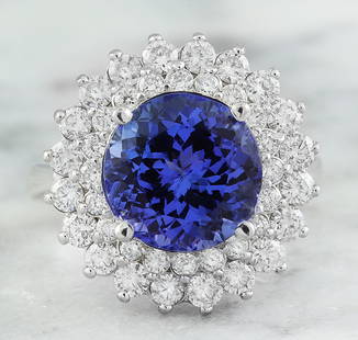 4.88 CTW Tanzanite 18K White Gold Diamond Ring: 4.88 CTW Tanzanite 18K White Gold Diamond Ring Manufacturer's Suggested Retail Price: $ 5600.00 Stamped: 18K Total Ring Weight: 6.3 Grams Tanzanite Weight 3.62 Carat (9.00x9.00 Millimeters)