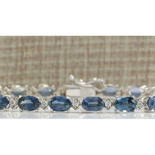 12.15 CTW Natural Sapphire And Diamond Bracelet In 14K Solid White Gold: 12.15 CTW Natural Sapphire And Diamond Bracelet In 14K Solid White Gold Manufacturer's Suggested Retail Price: $ 3500.00 Stamped: 14K Bracelet Width: 3.99mm Bracelet Length: 7.0 Inches 