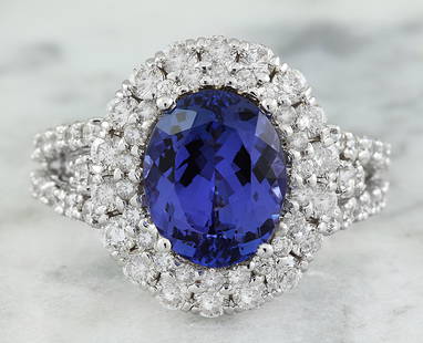 5.40 CTW Tanzanite 14K White Gold Diamond Ring: 5.40 CTW Tanzanite 14K White Gold Diamond Ring Manufacturer's Suggested Retail Price: $ 5900.00 Stamped: 14K Total Ring Weight: 6.1 Grams Tanzanite Weight 3.60 Carat (11.00x9.00 Millimeters)