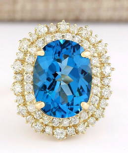 15.64 CTW Natural Blue Topaz And Diamond Ring In 18K Yellow Gold: 15.64 CTW Natural Blue Topaz And Diamond Ring In 18K Yellow Gold Manufacturer's Suggested Retail Price: $ 5600.00 Stamped: 18K Ring Size: 6 Total Ring Weight: 9.8 Grams Diamond Weight: 