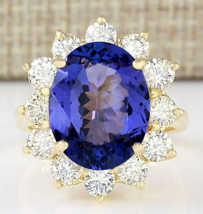 10.50 CTW Natural Blue Tanzanite And Diamond Ring 18K Solid Yellow Gold: 10.50 CTW Natural Blue Tanzanite And Diamond Ring 18K Solid Yellow Gold Manufacturer's Suggested Retail Price: $ 17200.00 Stamped: 18K Ring Size: 7.5 Total Ring Weight: 7.3 Grams Diamond