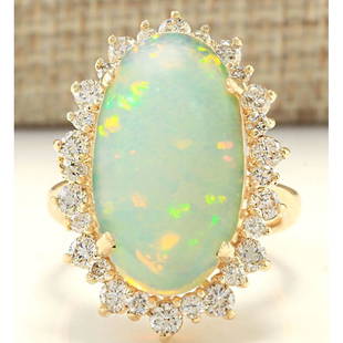 8.29 CTW Natural Opal And Diamond Ring In 14k Yellow Gold: 8.29 CTW Natural Opal And Diamond Ring In 14k Yellow Gold Manufacturer's Suggested Retail Price: $ 4900.00 Stamped: 14K Ring Size: 6.75 Total Ring Weight: 8.8 Grams Diamond Weight: Total