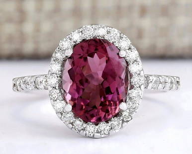3.02 CTW Natural Pink Tourmaline And Diamond Ring 14k Solid White Gold: 3.02 CTW Natural Pink Tourmaline And Diamond Ring 14k Solid White Gold Manufacturer's Suggested Retail Price: $ 3200.00 Stamped: 14K Ring Size: 6.75 Total Ring Weight: 3.2Grams Diamond