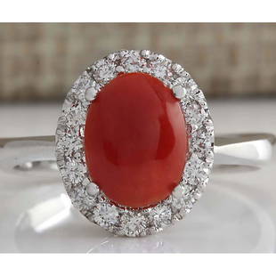 1.60 CTW Natural Red Coral And Diamond Ring 14K Solid White Gold: 1.60 CTW Natural Red Coral And Diamond Ring 14K Solid White Gold Manufacturer's Suggested Retail Price: $ 2400.00 Stamped: 14K Ring Size: 6.75 Total Ring Weight: 4 Grams Diamond Weight: 