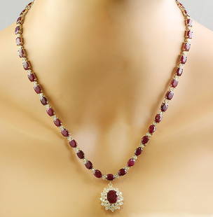 46.40 CTW Ruby 14K Yellow Gold Diamond Necklace: 46.40 CTW Ruby 14K Yellow Gold Diamond Necklace Manufacturer's Suggested Retail Price: $ 11800.00 Stamped: 14K Total Necklace Weight: 30.8 Grams Necklace Length: 18.5 Inches Center Ruby Weight: