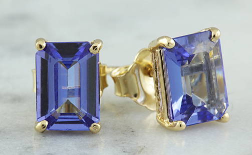 1.80 CTW Tanzanite 18K Yellow Gold Earrings: 1.80 CTW Tanzanite 18K Yellow Gold Earrings Manufacturer's Suggested Retail Price: $ 1100.00 Stamped: 18K Total Earrings Weight: 1.5 Grams Tanzanite Weight: 1.80 Carat (7.00x5.00 Millimeters) 