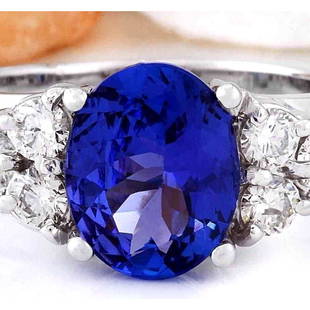 3.01 CTW Natural Tanzanite 14K Solid White Gold Diamond Ring: 3.01 CTW Natural Tanzanite 14K Solid White Gold Diamond Ring Manufacturer's Suggested Retail Price: $ 4000.00 3.01 Carat Natural Tanzanite 14K Solid White Gold Diamond Ring Item Type: Ring 