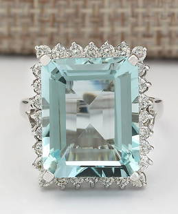 12.29 CTW Natural Aquamarine And Diamond Ring In 18K White Gold: 12.29 CTW Natural Aquamarine And Diamond Ring In 18K White Gold Manufacturer's Suggested Retail Price: $ 5300.00 Stamped: 18K Ring Size: 6.75 Total Ring Weight: 7.6 Grams Diamond Weight: 