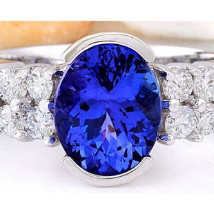 3.28 CTW Natural Tanzanite 18K Solid White Gold Diamond Ring: 3.28 CTW Natural Tanzanite 18K Solid White Gold Diamond Ring Manufacturer's Suggested Retail Price: $ 4500.00 3.28 Carat Natural Tanzanite 18K Solid White Gold Diamond Ring Item Type: Ring 