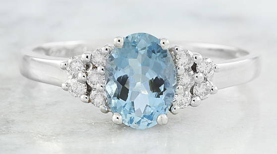 1.85 CTW Topaz 14K White Gold Diamond Ring: 1.85 CTW Topaz 14K White Gold Diamond Ring Manufacturer's Suggested Retail Price: $ 1700.00 Stamped: 14K Total Ring Weight: 2.8 Grams Topaz Weight 1.59 Carat ( 8.00x6.00 Millimeters) Diamond