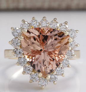 6.27 CTW Natural Peach Morganite And Diamond Ring In 14K Solid Yellow Gold: 6.27 CTW Natural Peach Morganite And Diamond Ring In 14K Solid Yellow Gold Manufacturer's Suggested Retail Price: $ 4200.00 Stamped: 14K Ring Size: 6.5 Total Ring Weight: 5.5 Grams Diamond