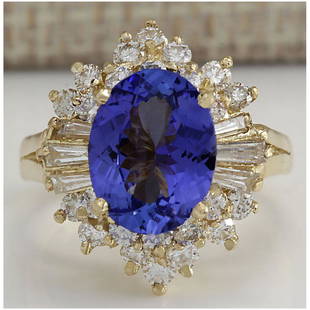 4.62 CTW Natural Blue Tanzanite And Diamond Ring 14K Solid Yellow Gold: 4.62 CTW Natural Blue Tanzanite And Diamond Ring 14K Solid Yellow Gold Manufacturer's Suggested Retail Price: $ 5400.00 Stamped: 14K Ring Size: 5.75 Total Ring Weight: 7.1 Grams Diamond