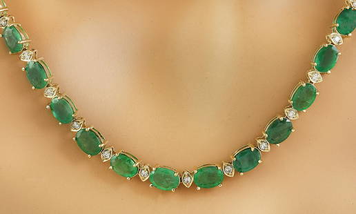 34.65 CTW Emerald 18K Yellow Gold Diamond Necklace: 34.65 CTW Emerald 18K Yellow Gold Diamond Necklace Manufacturer's Suggested Retail Price: $ 9900.00 Stamped: 18K Total Necklace Weight: 21 Grams Necklace Length: 18.5 Inches Emerald Weight: