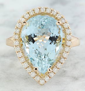 9.23 CTW Aquamarine 18K Rose Gold Diamond Ring: 9.23 CTW Aquamarine 18K Rose Gold Diamond Ring Manufacturer's Suggested Retail Price: $ 4400.00 Stamped: 18K Total Ring Weight: 6.6 Grams Aquamarine Weight 8.78 Carat ( 16.00x11.40