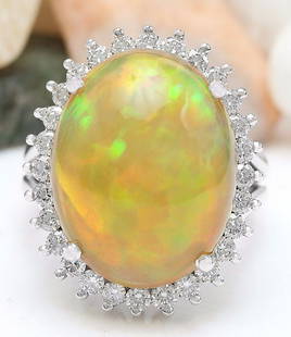 13.48 CTW Natural Opal 14K Solid White Gold Diamond Ring: 13.48 CTW Natural Opal 14K Solid White Gold Diamond Ring Manufacturer's Suggested Retail Price: $ 4600.00 13.48 Carat Natural Opal 14K Solid White Gold Diamond Ring Item Type: Ring Item