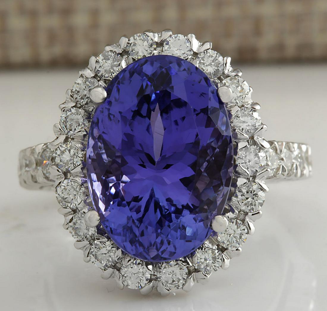 10.46 CTW Natural Blue Tanzanite And Diamond Ring In 18K White Gold: 10.46 CTW Natural Blue Tanzanite And Diamond Ring In 18K White Gold Manufacturer's Suggested Retail Price: $ 9600.00 Stamped: 18K Ring Size: 6.75 Total Ring Weight: 7.7 Grams Diamond Weight: Total Nat