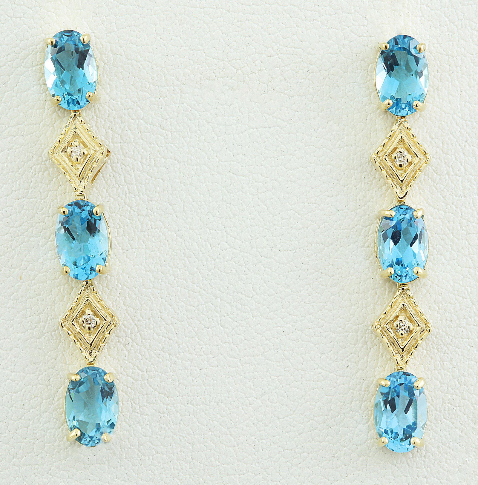 2.65 CTW Topaz 14K Yellow Gold Diamond Earrings: 2.65 CTW Topaz 14K Yellow Gold Diamond Earrings Manufacturer's Suggested Retail Price: $ 1100.00 Stamped: 14K Total Earrings Weight: 1.6 Grams Tourmaline Weight: 2.60 Carat (6.00x4.00 Millimeters) Dia