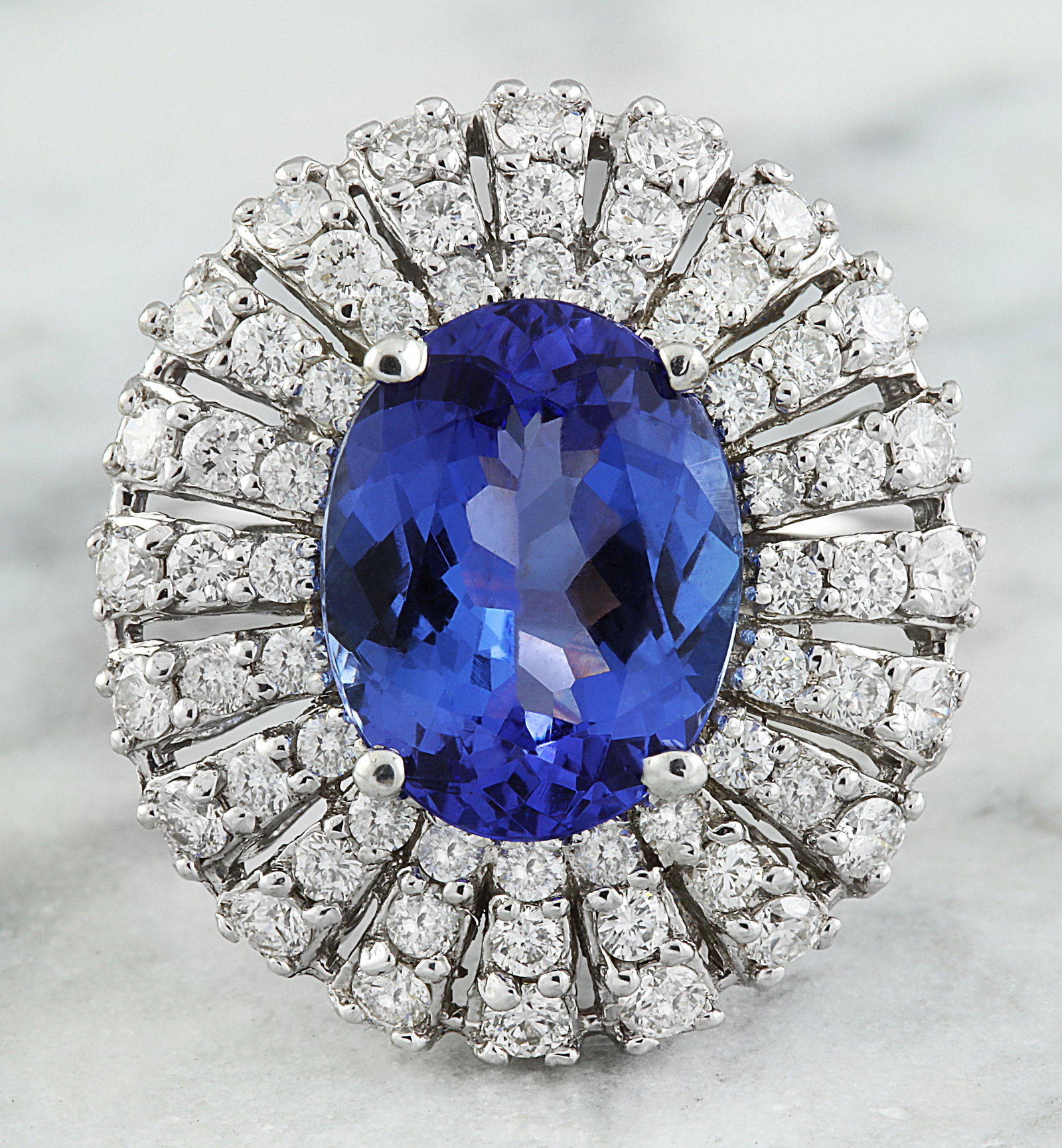 5.45 CTW Tanzanite 14K White Gold Diamond Ring: 5.45 CTW Tanzanite 14K White Gold Diamond Ring Manufacturer's Suggested Retail Price: $ 5700.00 Stamped: 14K Total Ring Weight: 8 Grams Tanzanite Weight 4.05 Carat (12.00x9.00 Millimeters) Diamond Wei