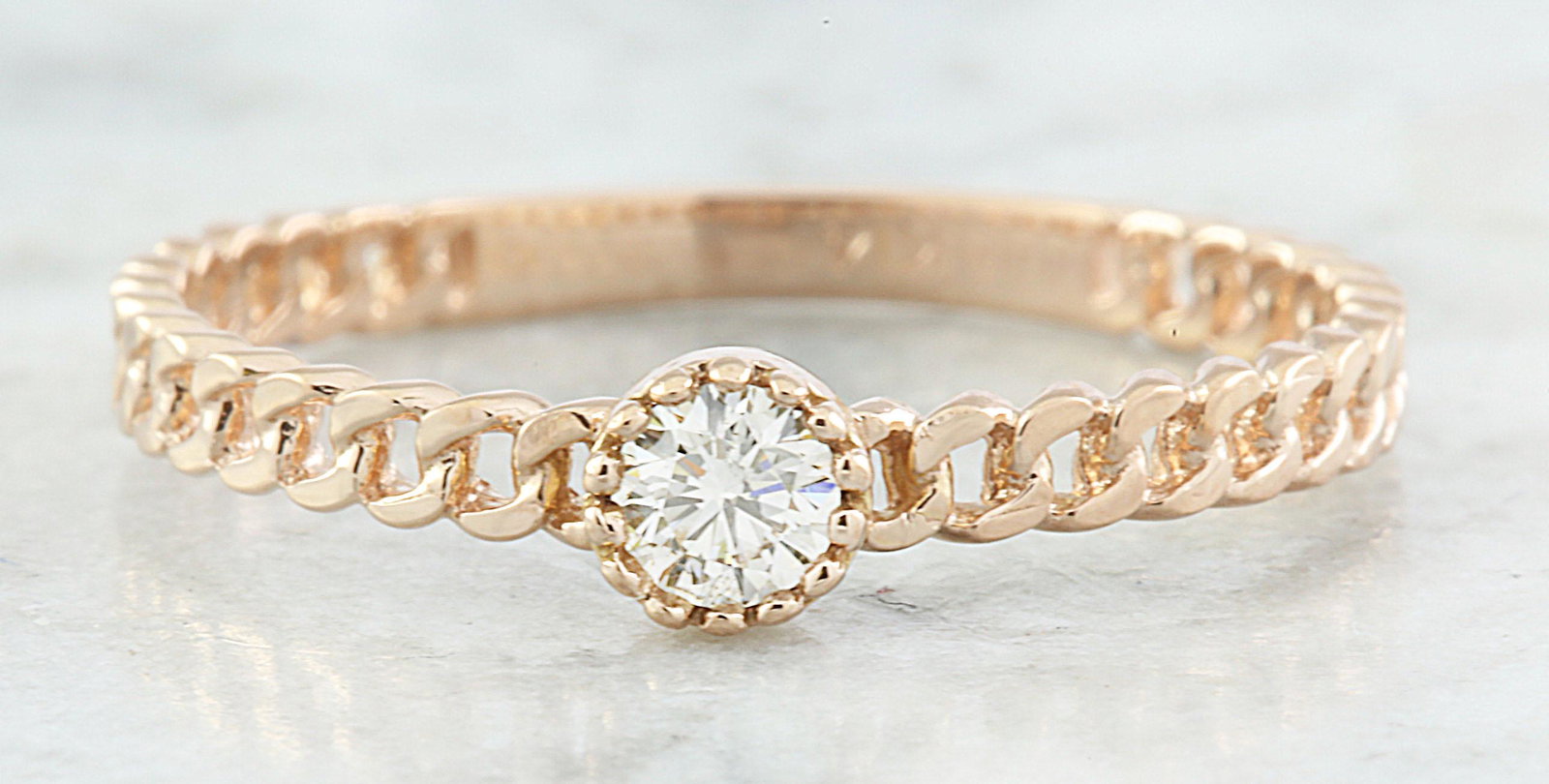 0.10 CTW Diamond 14K Rose Gold Solitaire Ring: 0.10 CTW Diamond 14K Rose Gold Solitaire Ring Manufacturer's Suggested Retail Price: $ 1100.00 Stamped: 14K Total Ring Weight: 1.2 Grams Diamond Weight: 0.10 carat (F-G Color, VS2-SI1 Clarity ) Face M