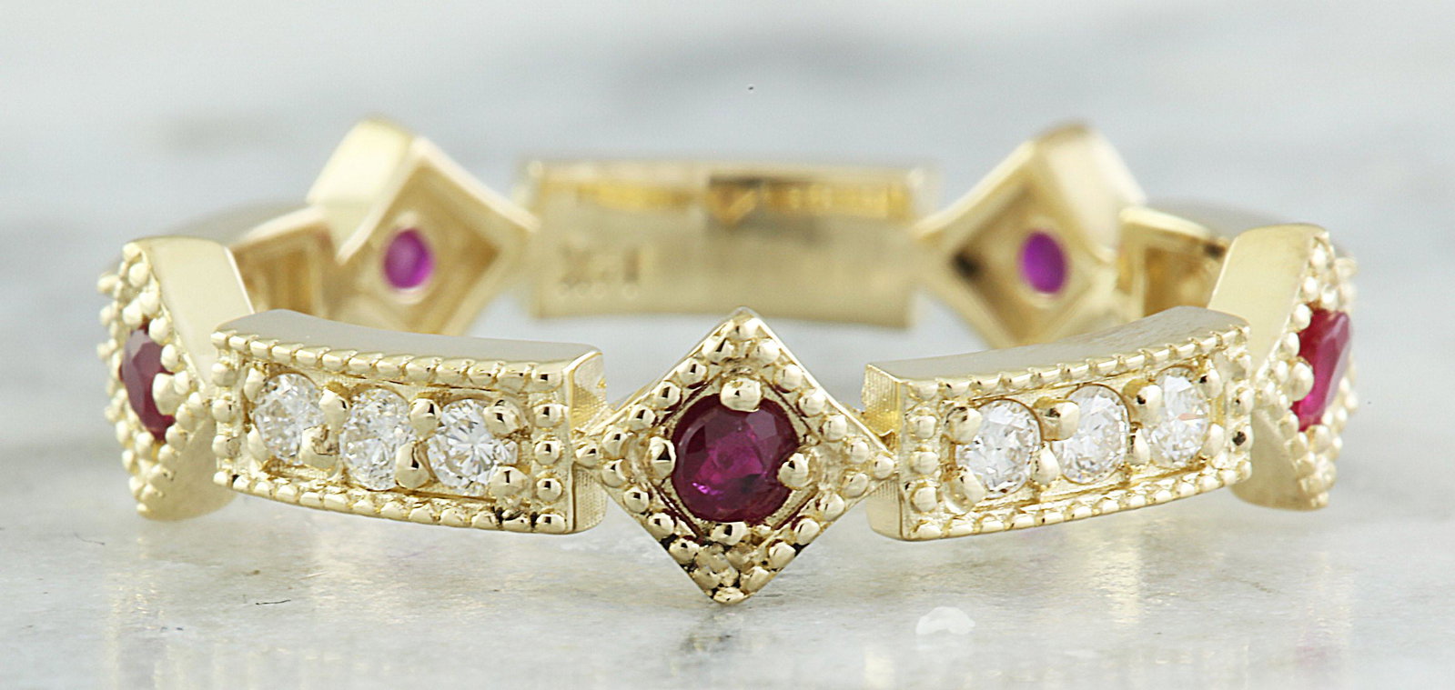 0.43 CTW Ruby 18K Yellow Gold Diamond Ring: 0.43 CTW Ruby 18K Yellow Gold Diamond Ring Manufacturer's Suggested Retail Price: $ 1900.00 Stamped: 18K Total Ring Weight: 2.8 Grams Ruby Weight: 0.18 Carat Diamond Weight: 0.28 carat (F-G Color, VS2