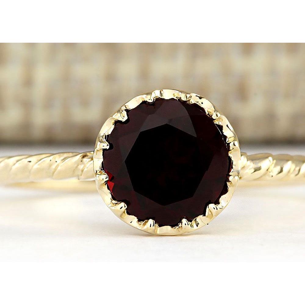 1.50 CTW Natural Garnet Ring In 18K Yellow Gold: 1.50 CTW Natural Garnet Ring In 18K Yellow Gold Manufacturer's Suggested Retail Price: $ 1100.00 Stamped: 18K Ring Size: 6.75 Total Ring Weight: 1.8 Grams Gemstone Weight: Total Natural Garnet Weight 