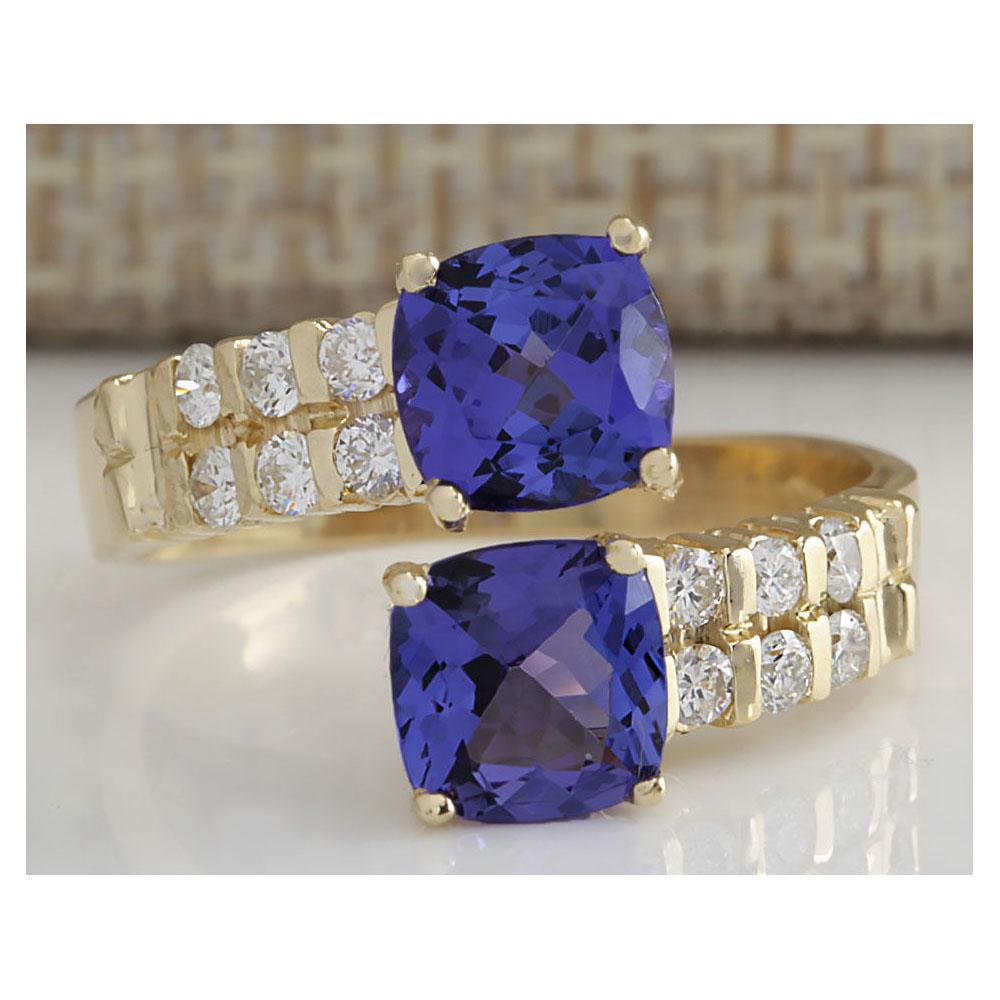 2.82 CTW Natural Blue Tanzanite And Diamond Ring In 18K Solid Yellow Gold: 2.82 CTW Natural Blue Tanzanite And Diamond Ring In 18K Solid Yellow Gold Manufacturer's Suggested Retail Price: $ 3500.00 Stamped: 18K Ring Size: 7.25 Total Ring Weight: 4.5 Grams Diamond Weight: Tot