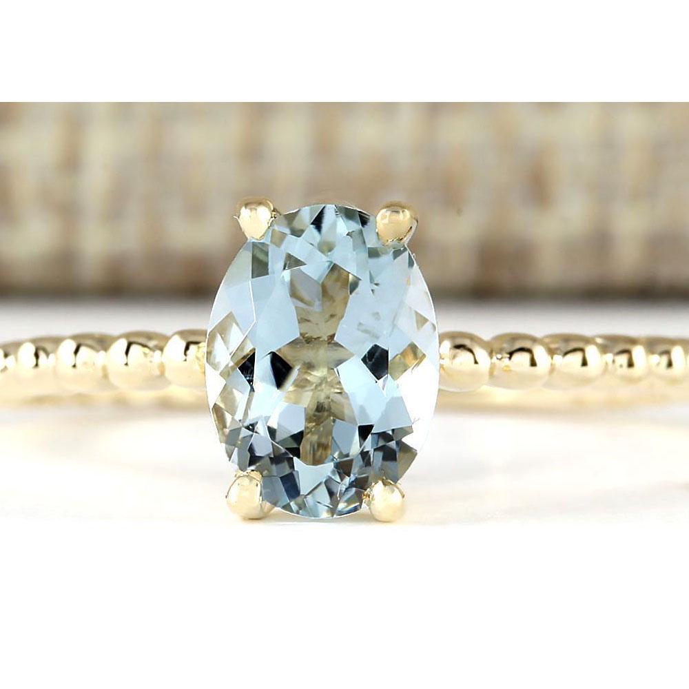 1.07 CTW Natural Aquamarine Ring In 18K Yellow Gold: 1.07 CTW Natural Aquamarine Ring In 18K Yellow Gold Manufacturer's Suggested Retail Price: $ 1100.00 Stamped: 18K Ring Size: 6.5 Total Ring Weight: 2 Grams Gemstone Weight: Total Natural Aquamarine We