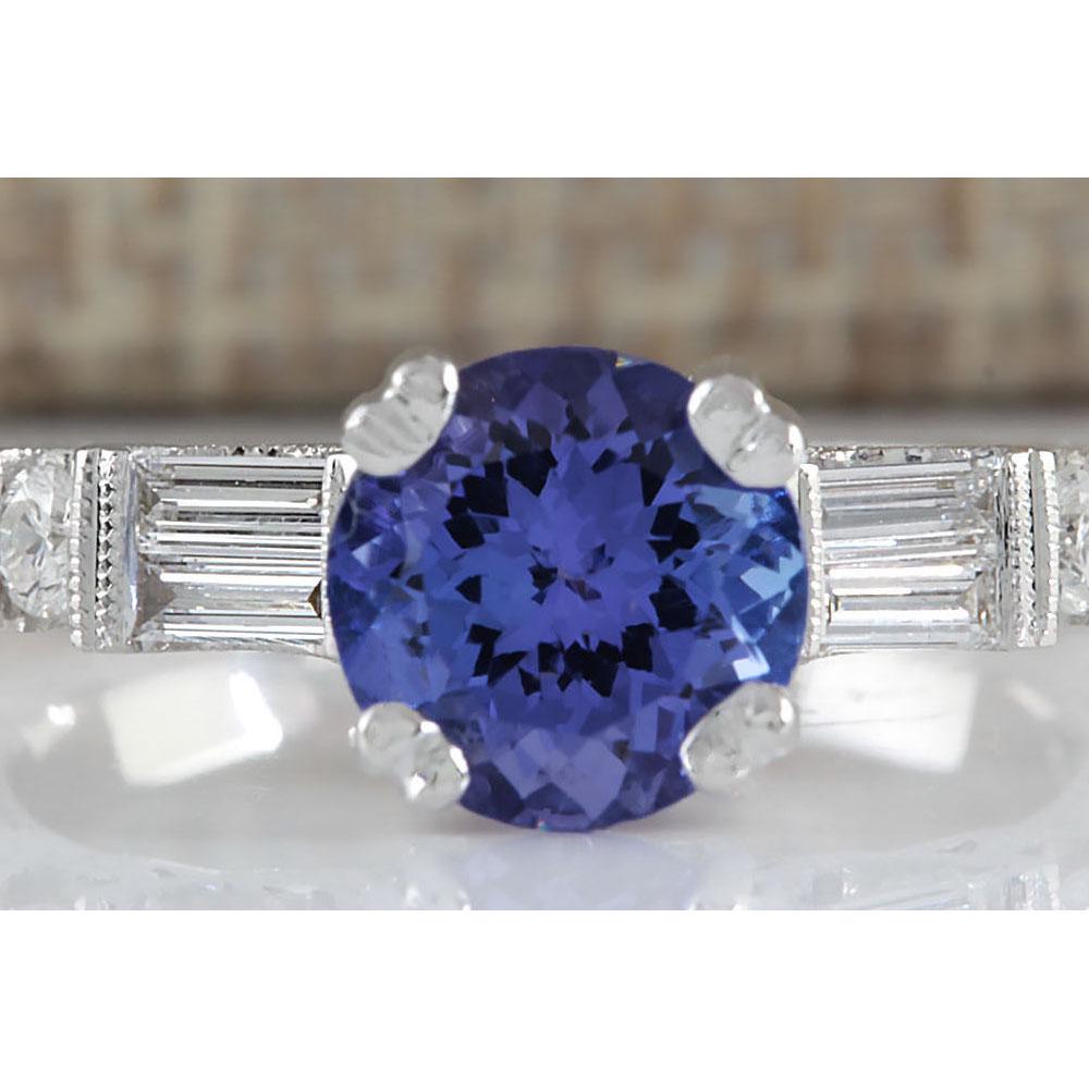 2.36 CTW Natural Blue Tanzanite And Diamond Ring 14K Solid White Gold: 2.36 CTW Natural Blue Tanzanite And Diamond Ring 14K Solid White Gold Manufacturer's Suggested Retail Price: $ 3200.00 Stamped: 14K Ring Size: 6.5 Total Ring Weight: 4.9 Grams Diamond Weight: Total Na