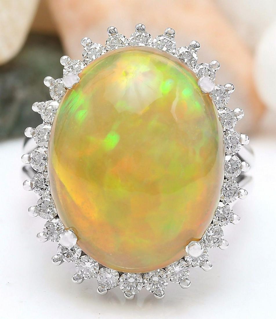 13.48 CTW Natural Opal 18K Solid White Gold Diamond Ring: 13.48 CTW Natural Opal 18K Solid White Gold Diamond Ring Manufacturer's Suggested Retail Price: $ 5100.00 13.48 Carat Natural Opal 18K Solid White Gold Diamond Ring Item Type: Ring Item Style: Cocktai