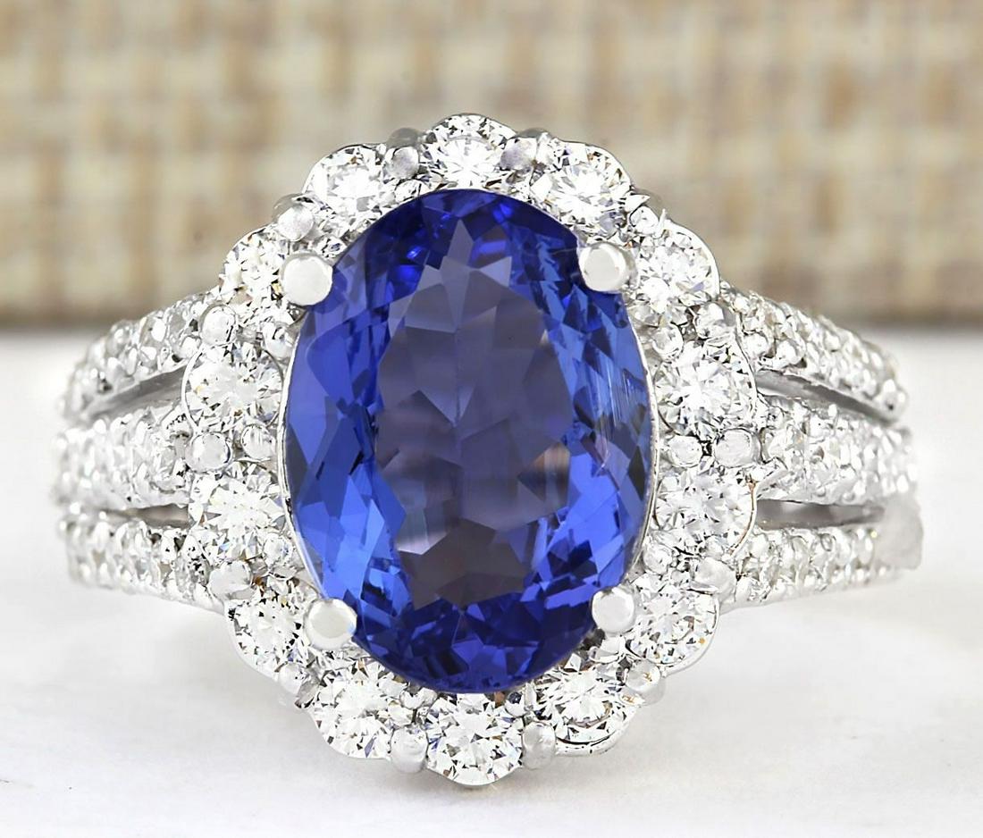 5.42 CTW Natural Blue Tanzanite And Diamond Ring 18K Solid White Gold: 5.42 CTW Natural Blue Tanzanite And Diamond Ring 18K Solid White Gold Manufacturer's Suggested Retail Price: $ 7200.00 Stamped: 18K Ring Size: 7 Total Ring Weight: 8.6 Grams Diamond Weight: Total Natu