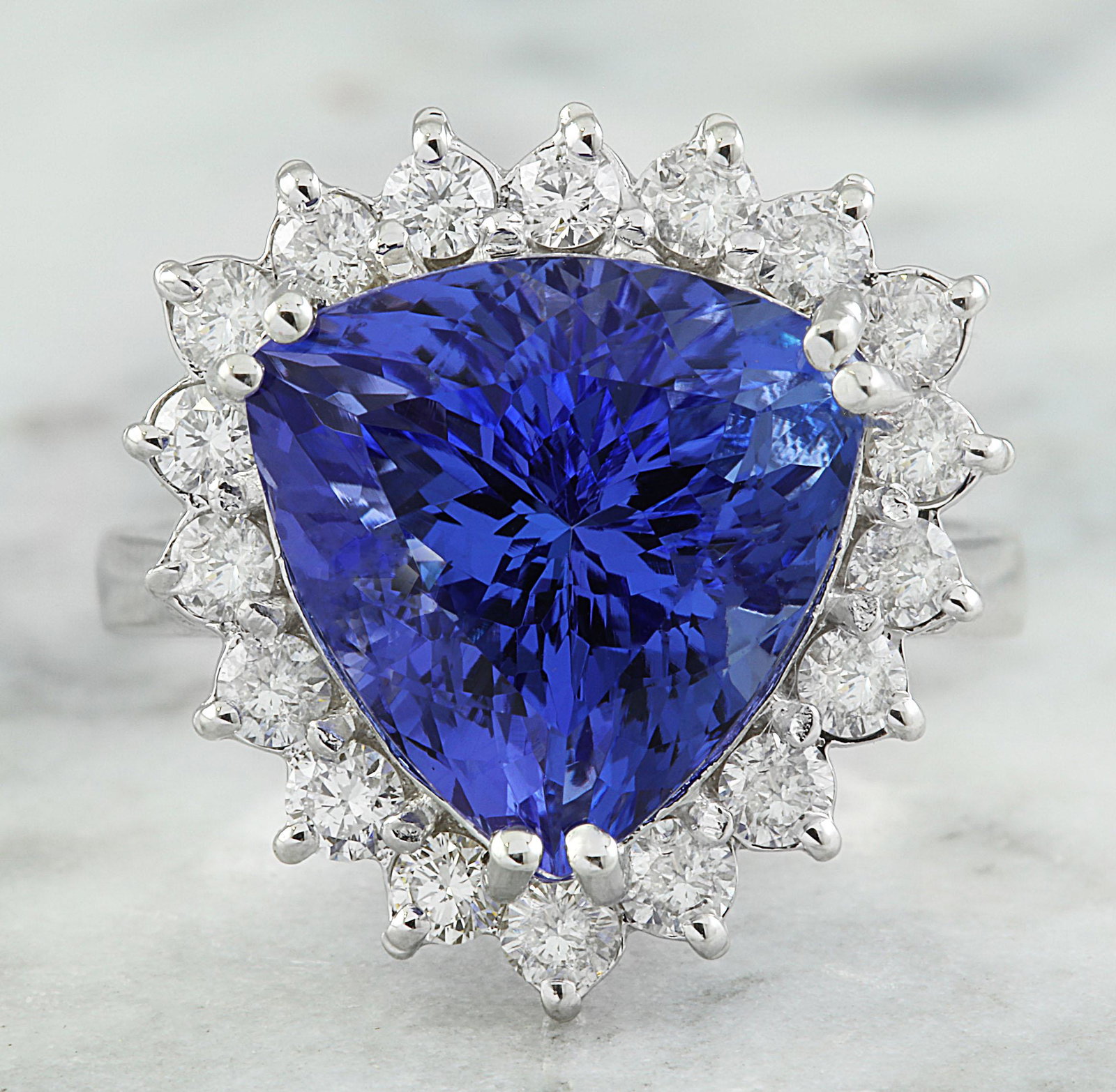 8.12 CTW Tanzanite 18K White Gold Diamond Ring: 8.12 CTW Tanzanite 18K White Gold Diamond Ring Manufacturer's Suggested Retail Price: $ 7300.00 Stamped: 18K Total Ring Weight: 5.1 Grams Tanzanite Weight 7.22 Carat (12.60x12.30 Millimeters) Diamond 