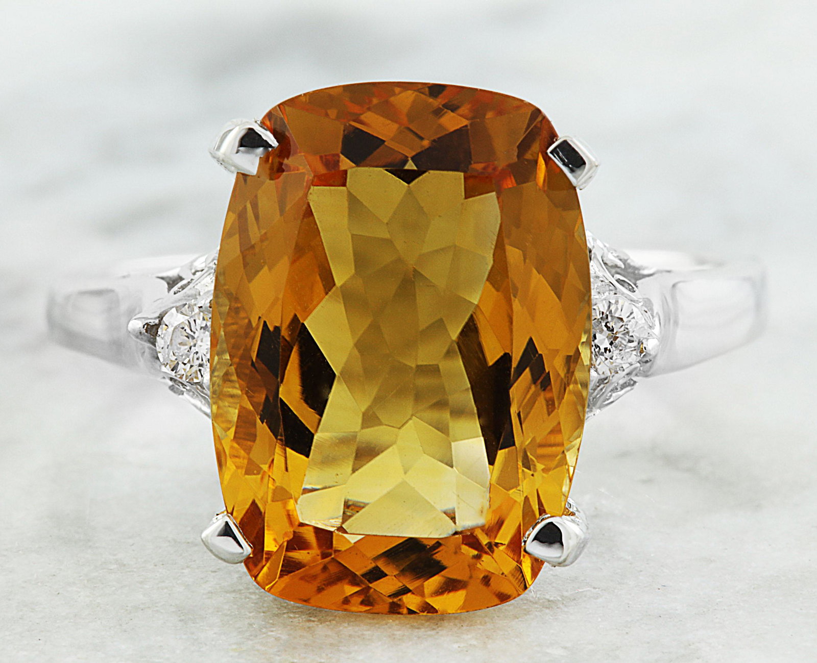 6.26 CTW Citrine 18K White Gold Diamond Ring: 6.26 CTW Citrine 18K White Gold Diamond Ring Manufacturer's Suggested Retail Price: $ 2000.00 Stamped: 18K Total Ring Weight: 4 Grams Citrine Weight 6.20 Carat (14.00x10.00 Millimeters) Diamond Weight
